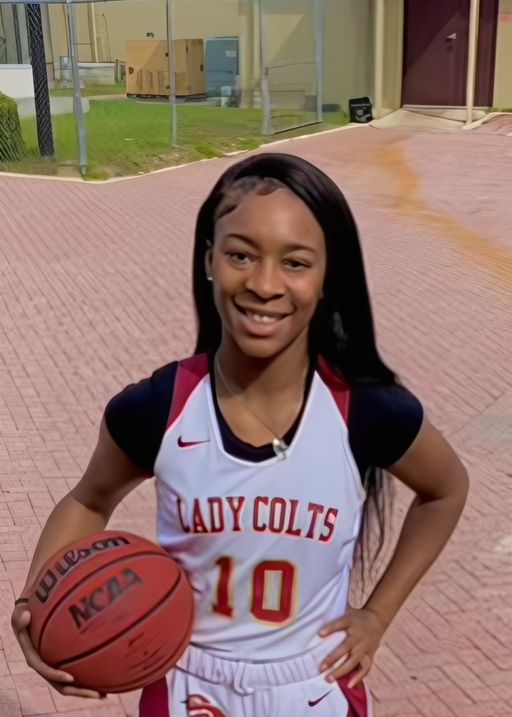 Photo of D'Nhia Johnson in North Marion High basketball uniform.